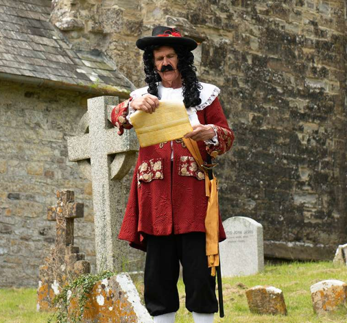 A picture of the town crier at Oak Apple Day